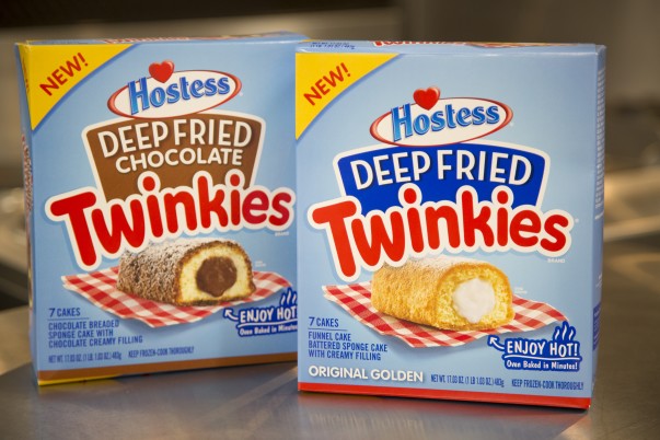 A box of deep fried chocolate twinkies beside a box of deep fried twinkies 