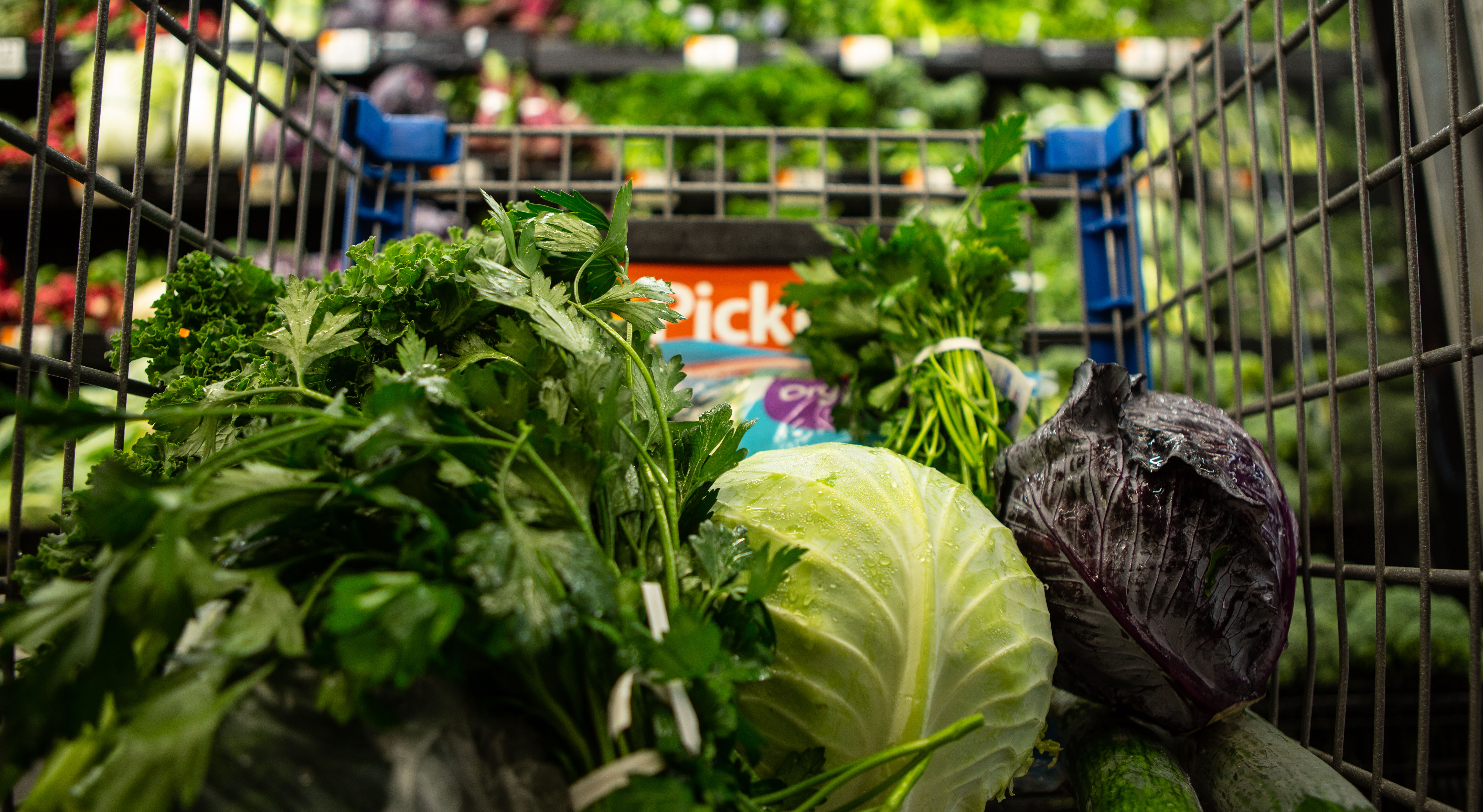 Lettuce and fresh produce in a shopping cart