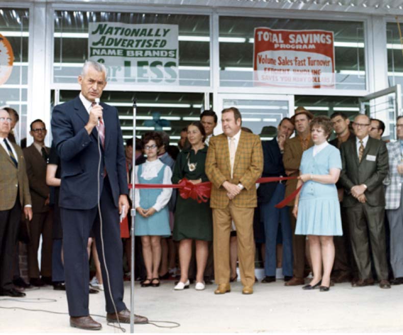 Sam Walton speaks to the community at opening of the first Walmart in Rogers, Arkansas