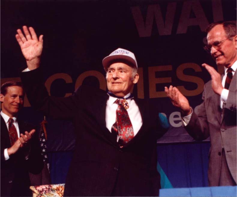 Sam Walton waves to audience during an event in the 1990s