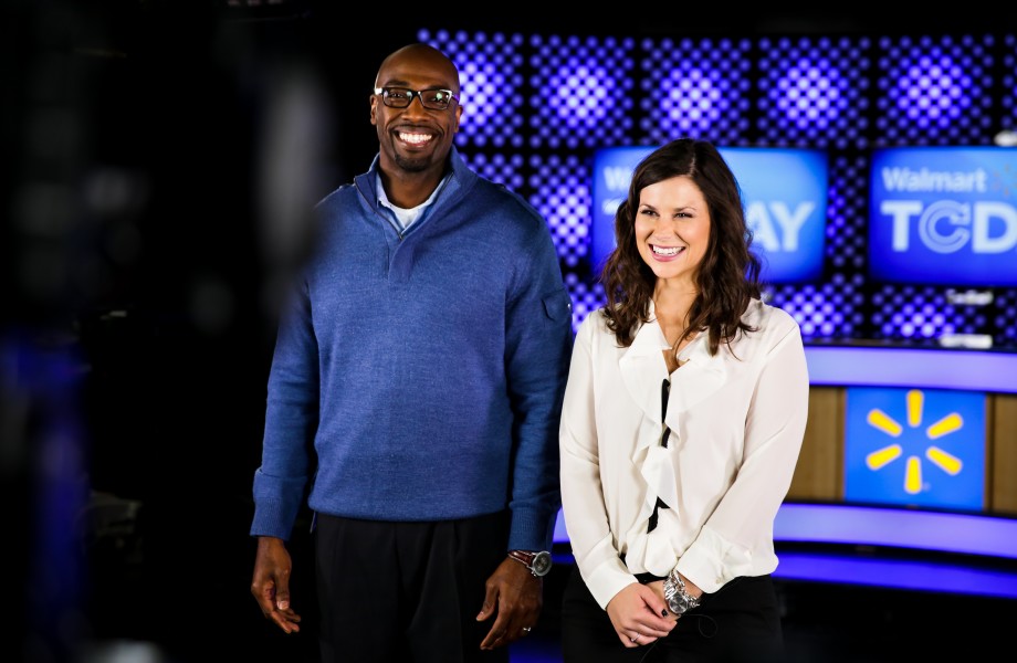 A male associate and a female associate stand on the set as they host the Walmart Today TV Show
