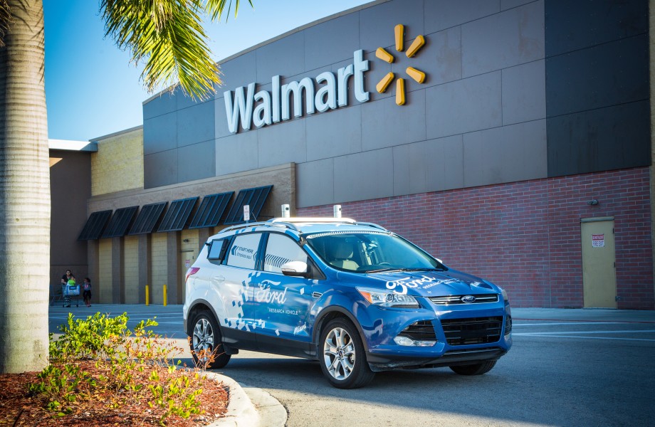 A Ford self-driving vehicle outside a Walmart Supercenter