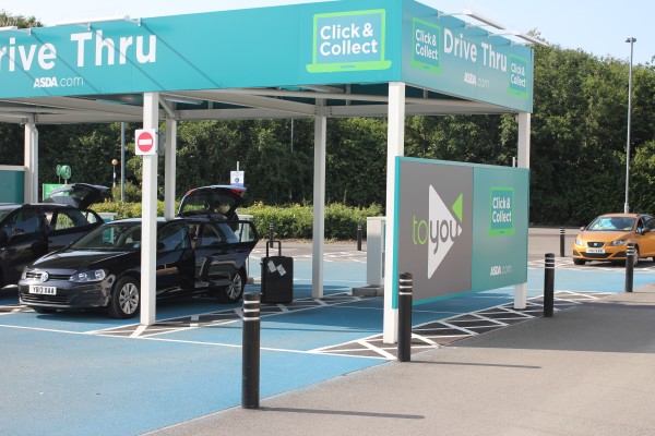 A drive thru area has several stalls for parked cars to wait for customers' Click & Collect items